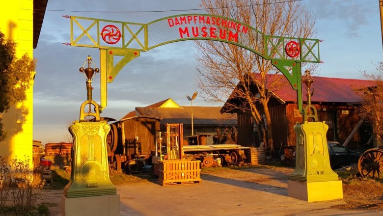 Entrance gate to the steam engine museum with decorative pillars and lettering.