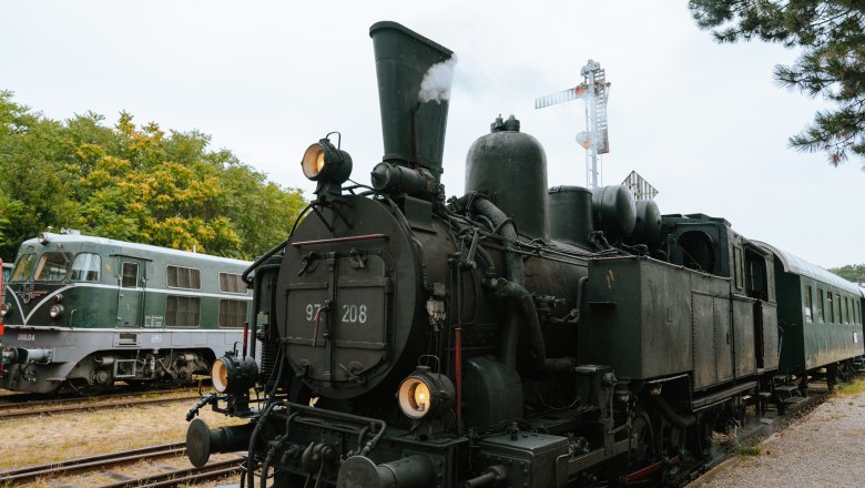 Steam locomotive and diesel locomotive in the Strasshof Railway Museum.